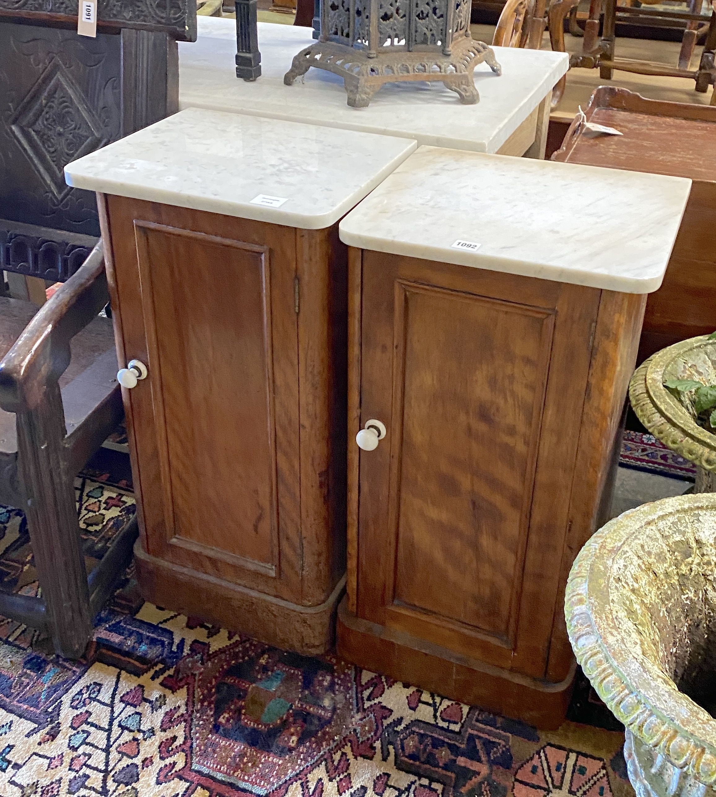 A pair of Victorian satin walnut bedside cupboards with white marble tops, width 39cm, depth 34cm, height 78cm